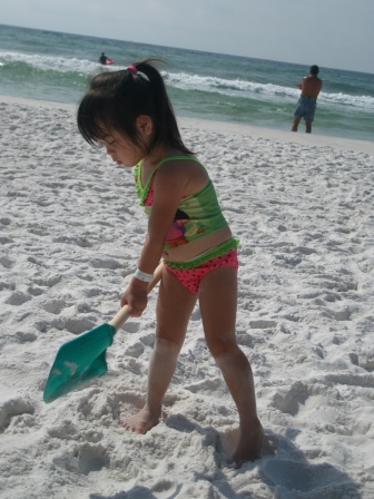 Karis digging in the sand